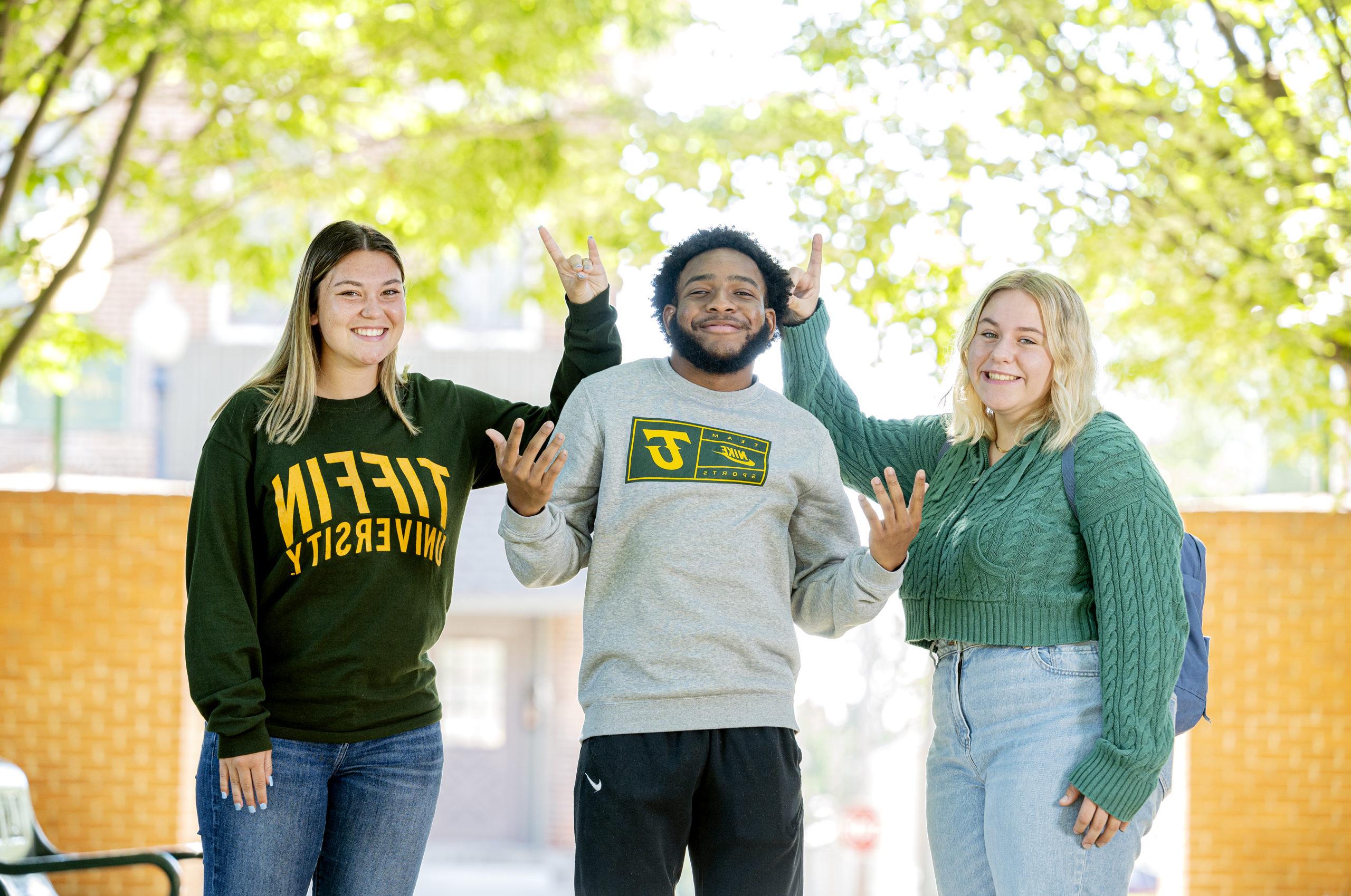 Smiling students outside